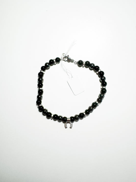 Bracciale con ciondolo ferro di cavallo e calcedonio nero